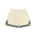 Men's loose-fit polyester sports shorts in apricot colour on a grey background.