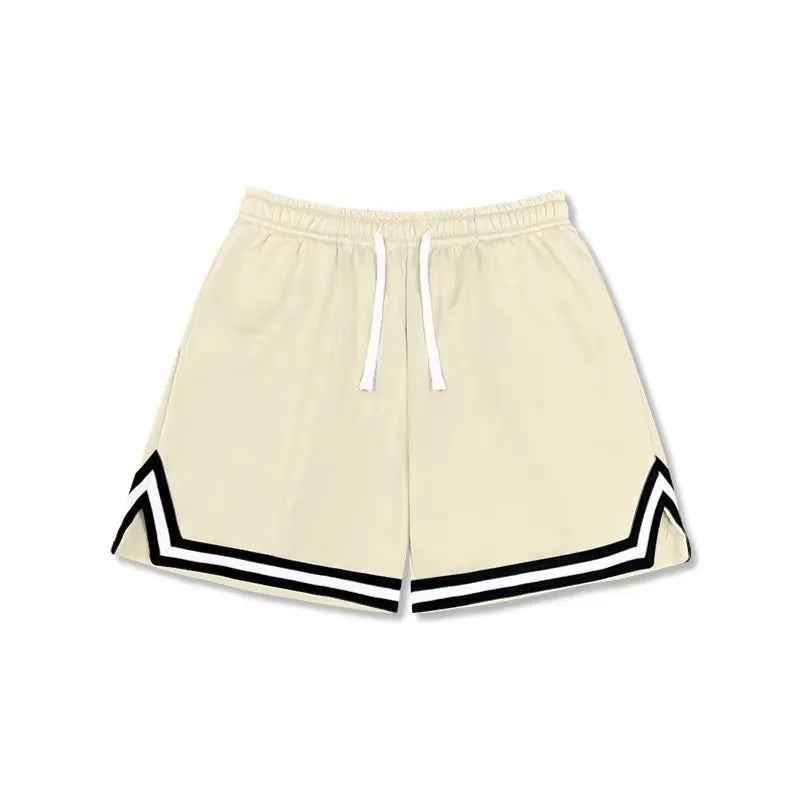 Men's loose-fit polyester sports shorts in apricot colour on a grey background.