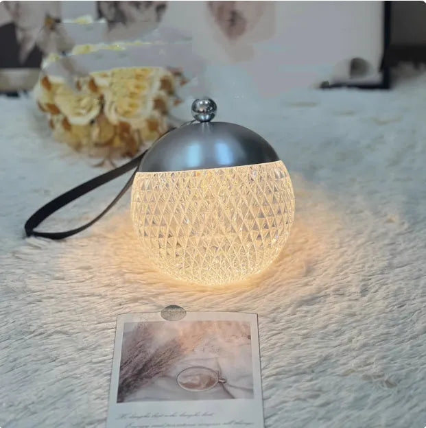 Modern cylindrical dimmable night lamp with touch control in a choice of five colours.