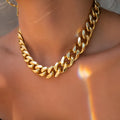 Gold-colour thick chain women's necklace with a 6cm component on a 32cm chain.