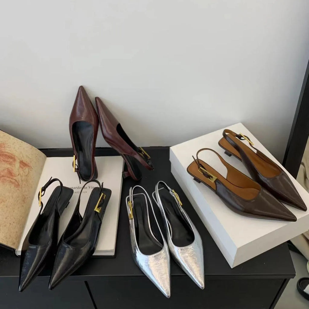 Thin low heel strap pointed leather shoes in black, red, brown, and silver colour options showing rubber soles