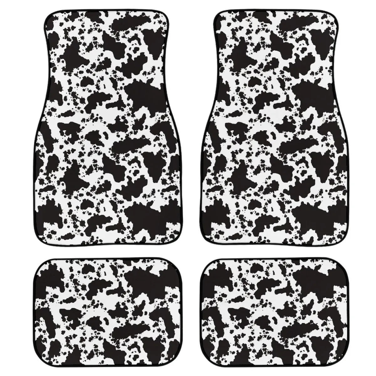 Set of four black printed rubber car floor mats with textured surface, showing thickness.