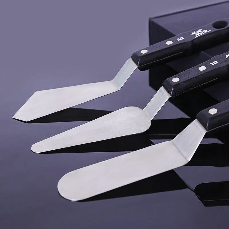 Three stainless steel palette knives for oil and acrylic painting with different blade sizes.