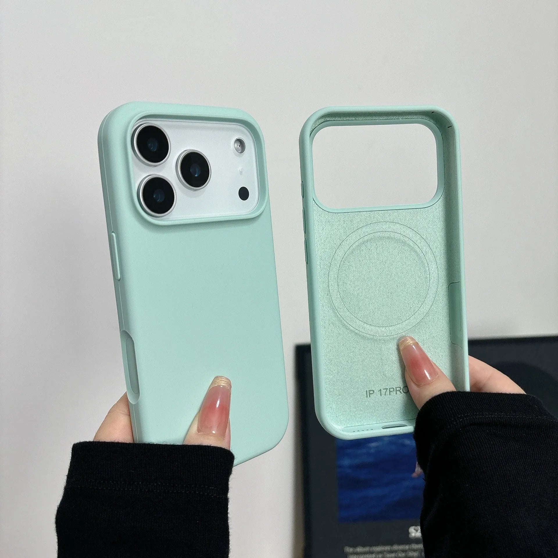 Magnetic liquid silicone iPhone case with Ai button for iPhone 12, 13, 14 models in antique white colour.