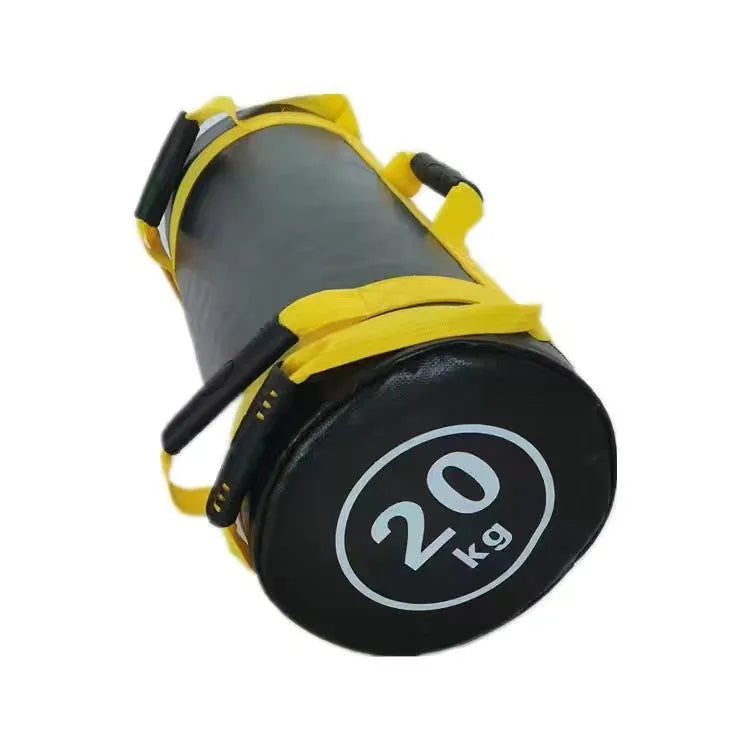 A flat white PVC power lifting sandbag for weight training on a gym floor.