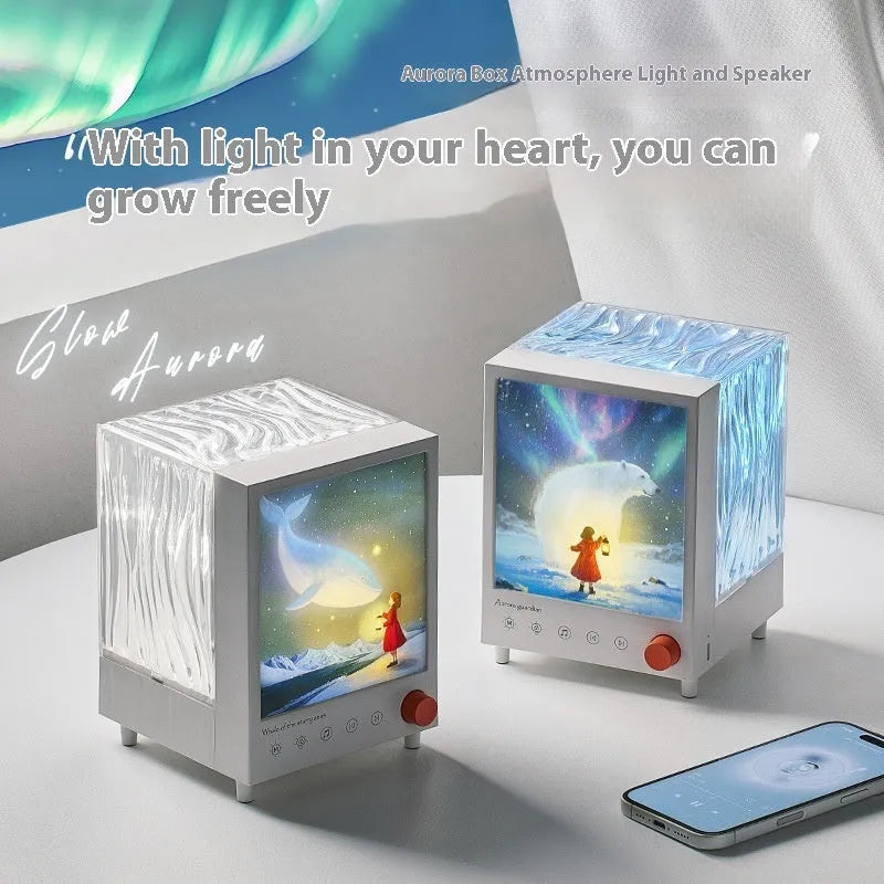 Aurora Treasure Box Star Sea Whale atmosphere projection lamp with Bluetooth speaker on a table.