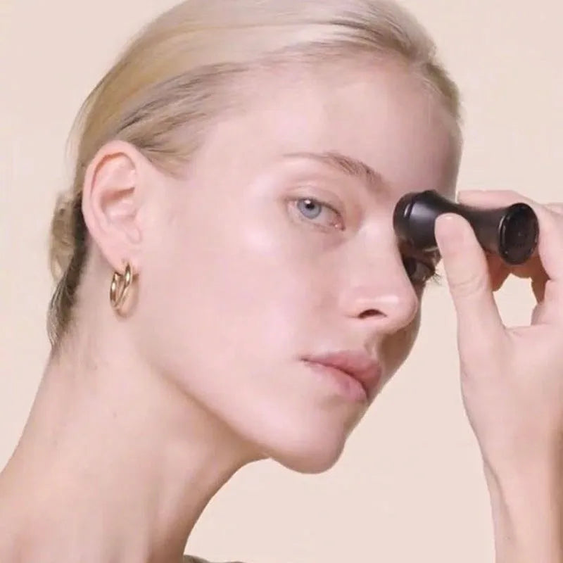 Portable volcanic stone facial roller for oil control, shown in choice of black, green, pink, or white.