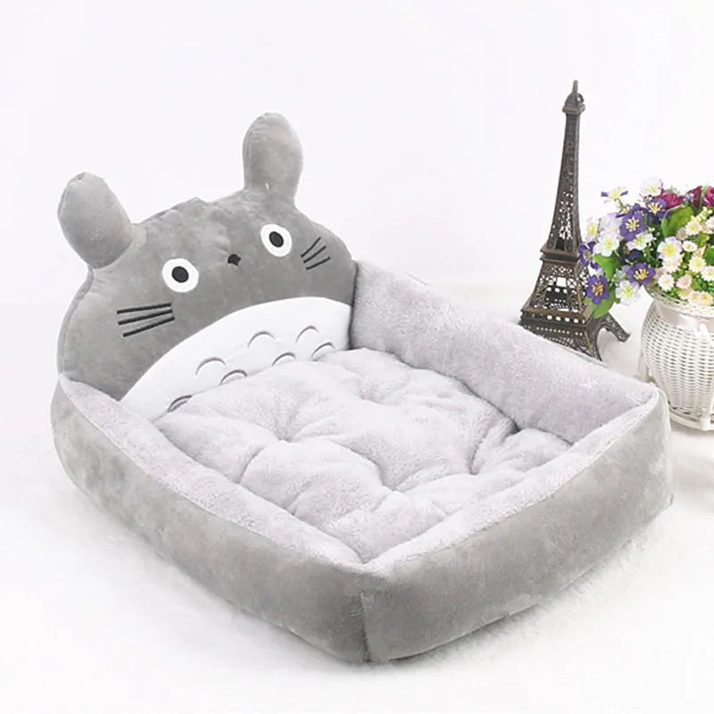 Cartoon-style plush pet bed sofa in blue, shown in small size for a dog or cat.