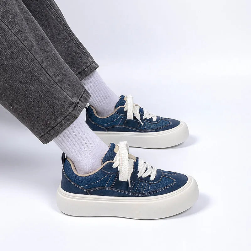 Men's black casual canvas shoes with platform sole and lace-up front.