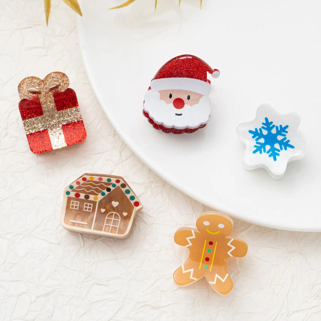 Oil-finished acrylic Christmas series small jaw clip barrette with snowflake design on white background