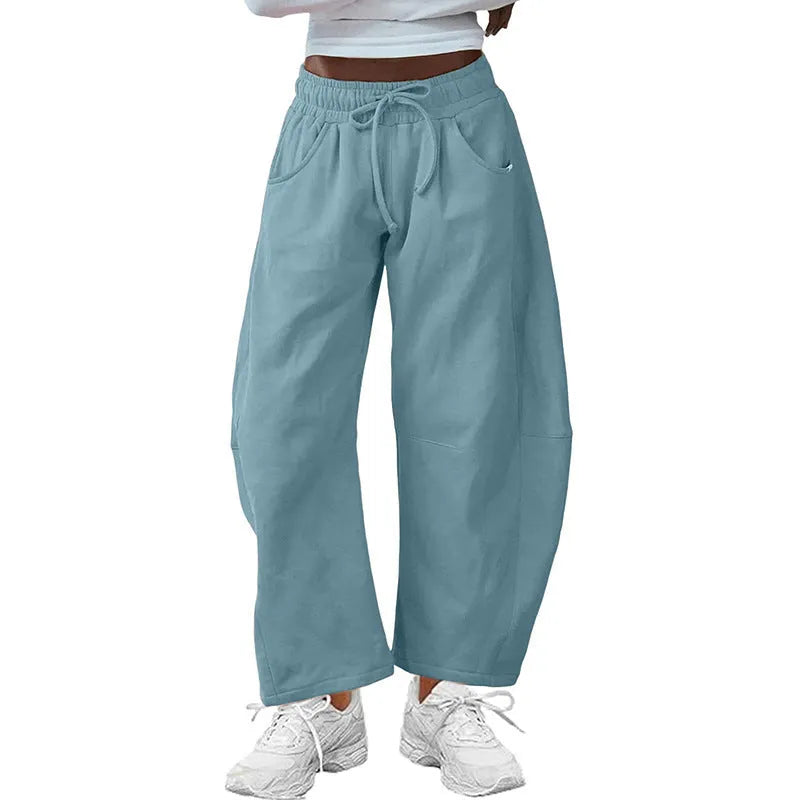 Women's loose-fit cropped sweatpants with drawstring waist and side pockets in cotton blend fabric