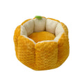 Pumpkin-shaped pet nest with raised sides and cotton filling for cats and small dogs