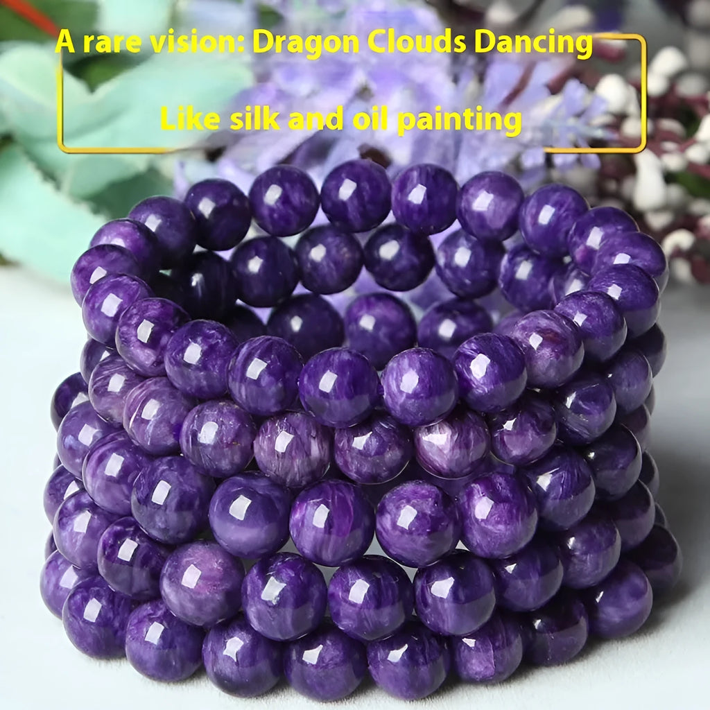 Natural transparent charoite hands design bead bracelet with platinum setting on a wrist.