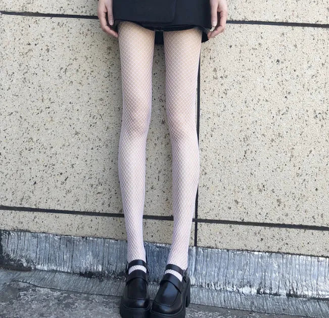 Women's sheer mesh pantyhose showing large, medium and small pattern options in black and white colours