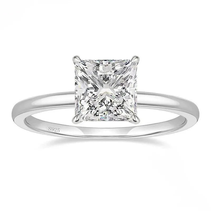 A geometric 925 sterling silver ring with a round zirconium detail, shown in silver, gold, and rose gold colour options.