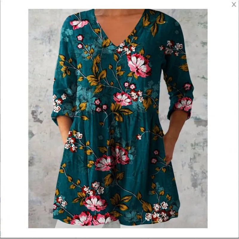 Women's loose-fitting long dress with a blue wave pattern print and 3/4 sleeves.