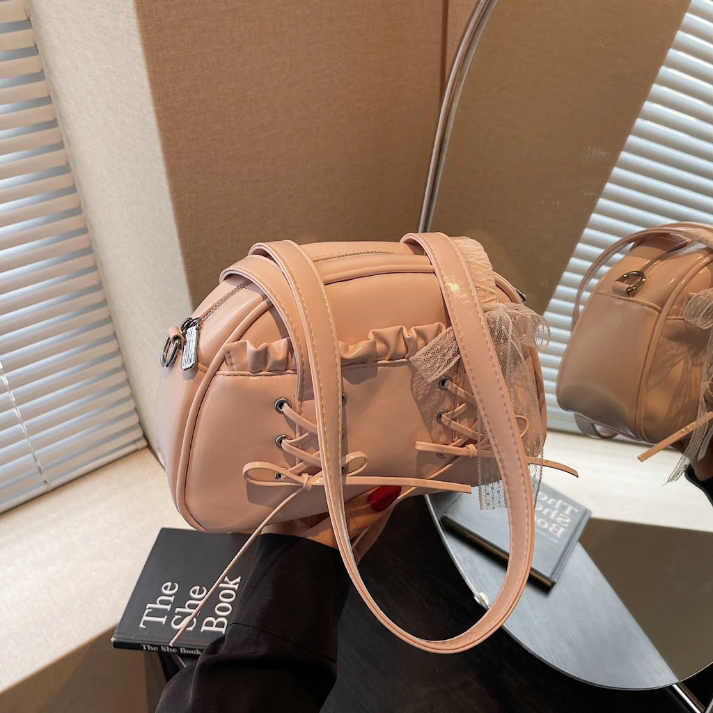 Women's casual PU leather shoulder handbag with a bandage bow detail, shown in beige colour.