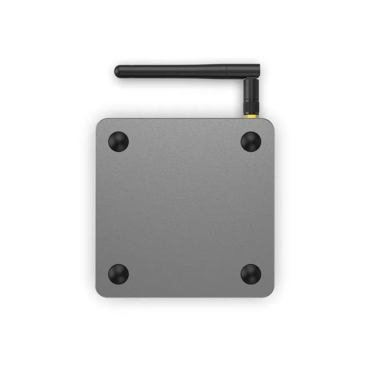 Android Smart Voice Set-top Box with remote, HDMI cable, and power adapter on a table.