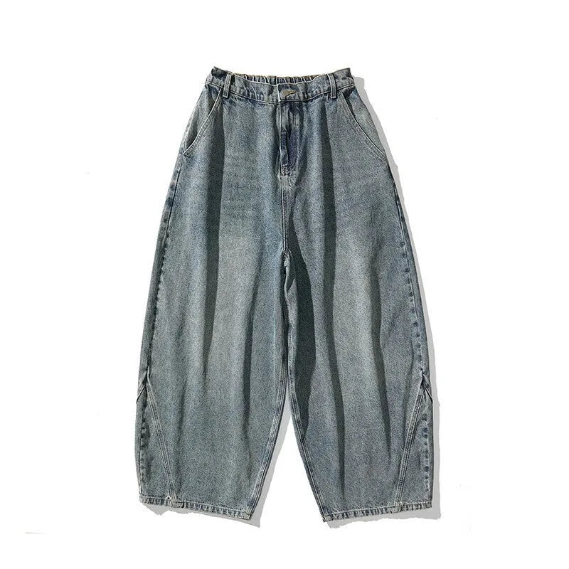 Men's plus size baggy blue denim jeans with a straight leg and low waist on a hanger.