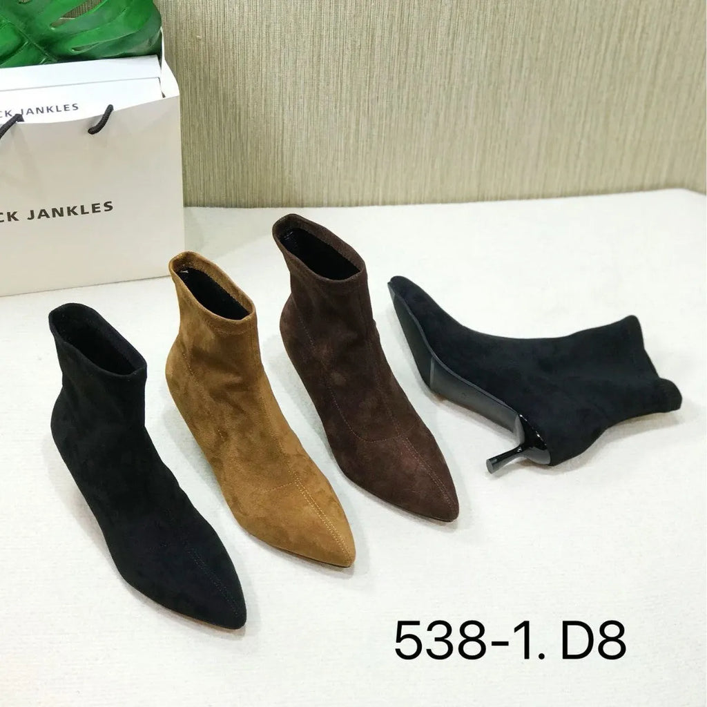 Black pointed toe women's ankle boots with a stiletto heel and mid-calf sock length on a white background
