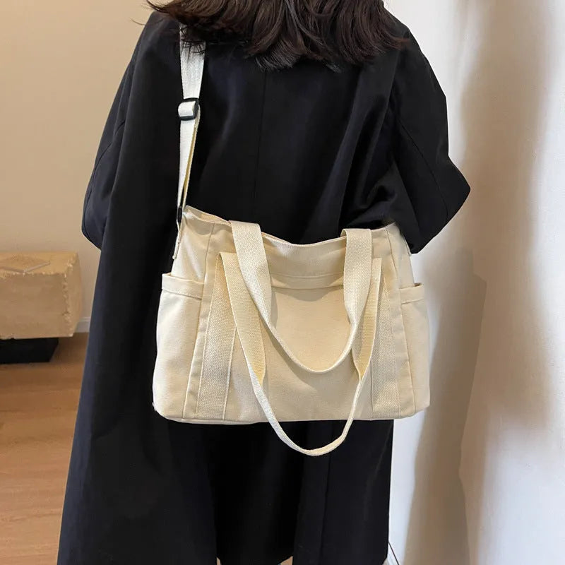 Women's polyester canvas shoulder tote bag with large capacity and internal mobile phone pocket storage