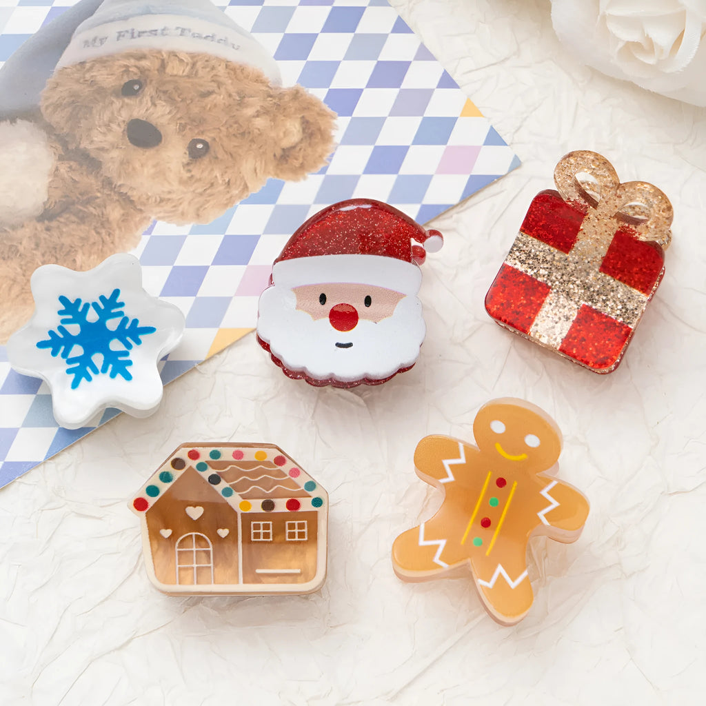 Oil-finished acrylic Christmas series small jaw clip barrette with snowflake design on white background