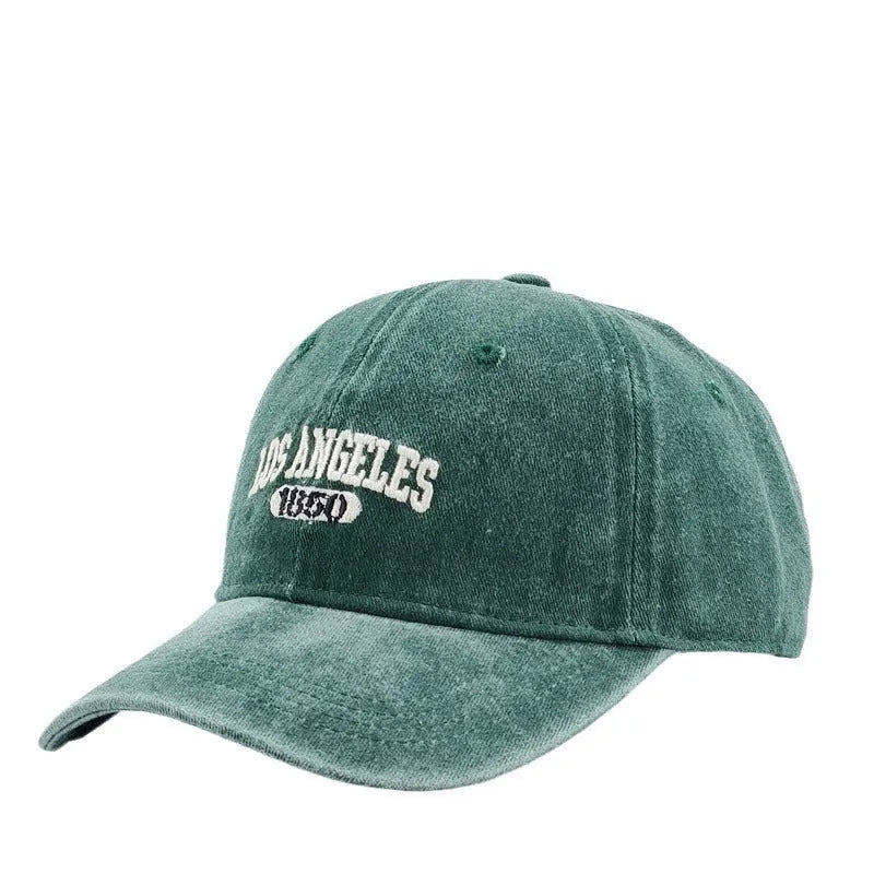 Retro personalised embroidered letters peaked cap in distressed fabric, adjustable fit, shown in beige colour.