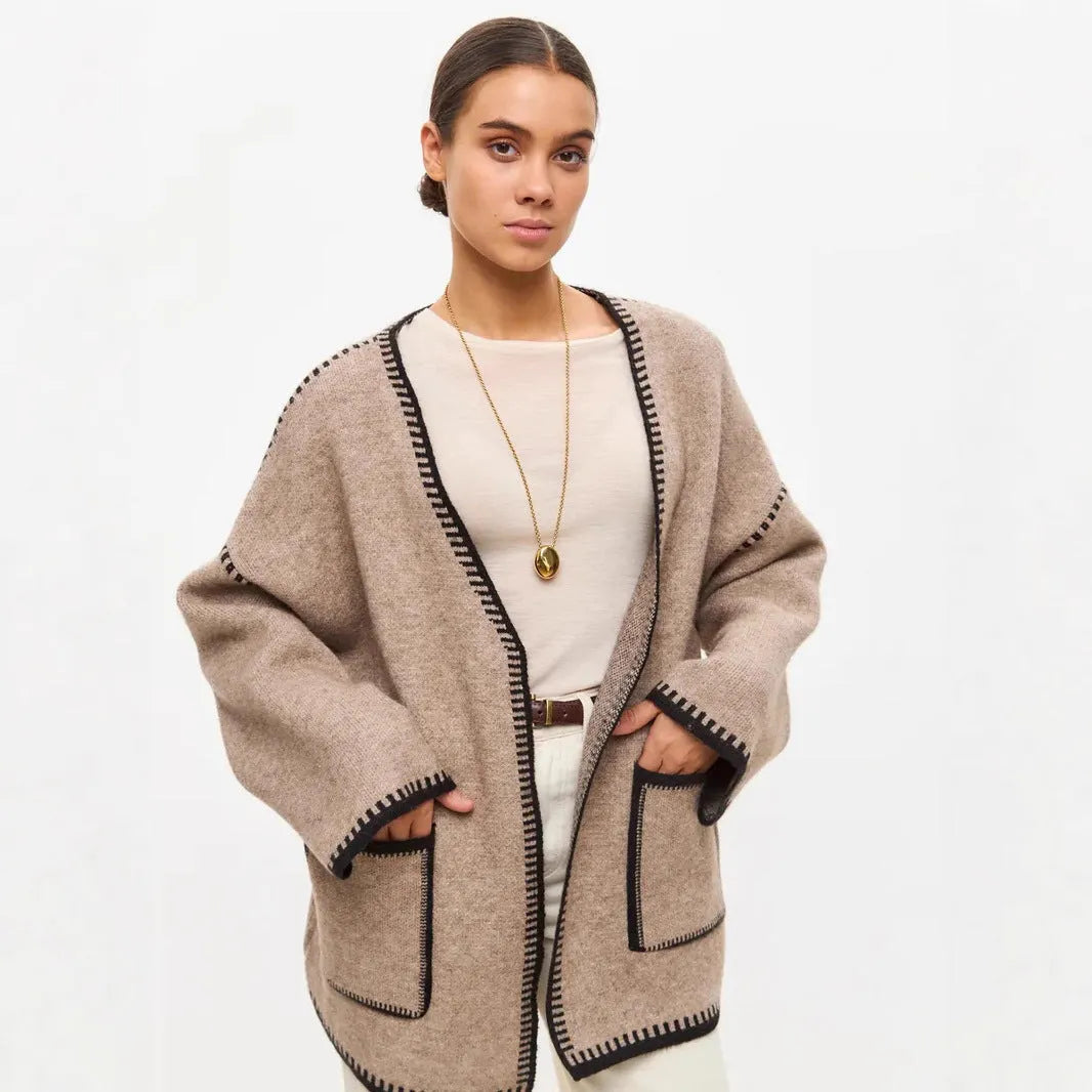 Loose mid-length knitted cardigan with lace-up front, in white, black, or camel.