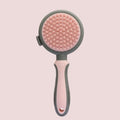 Green two-sided cat grooming brush with retractable slicker and silicone massager head