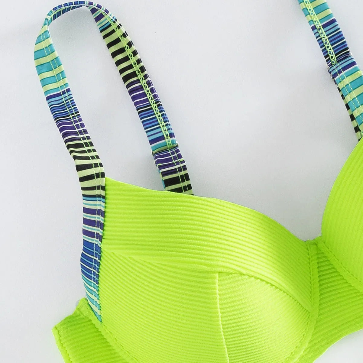 Green printed halter neck bikini set for women, showing top and briefs.