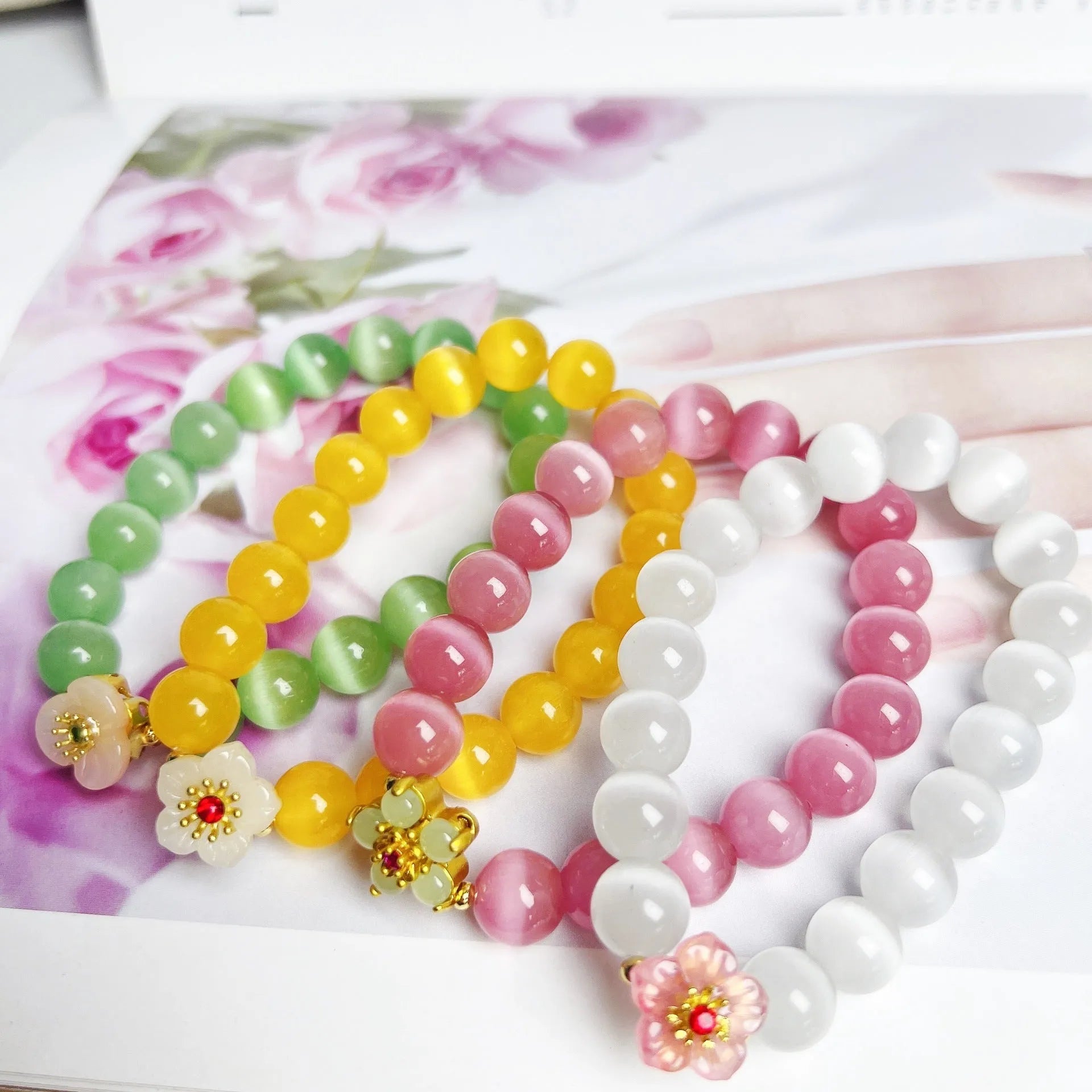 Handmade women's glass beaded bracelet with flower elements in multiple colour options
