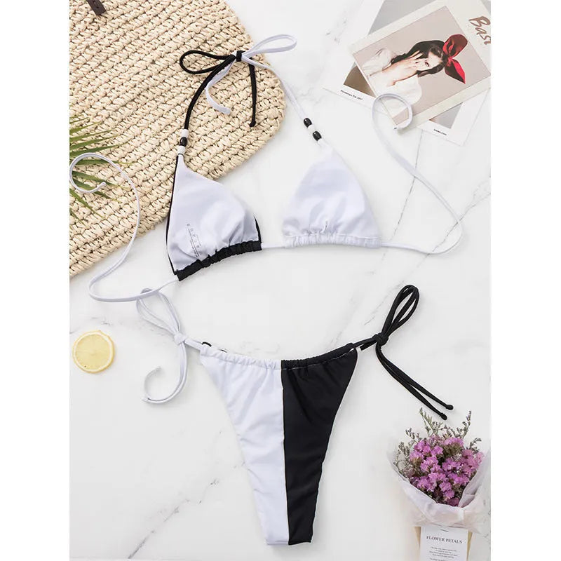 Women's black and white lace-up triangle cup bikini swimsuit with briefs-style bottoms