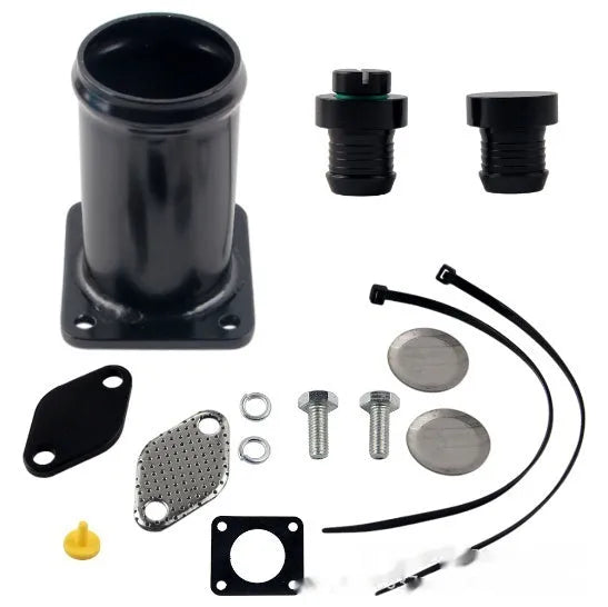 BMW E46 diesel EGR removal kit showing black metal pipe, blanking plates, bolts, and vacuum plug