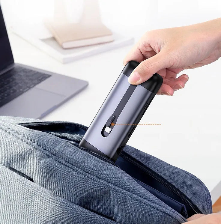 USB-C docking station adapter showing either 5-in-1 or 9-in-1 port configuration on a compact 9cm body.