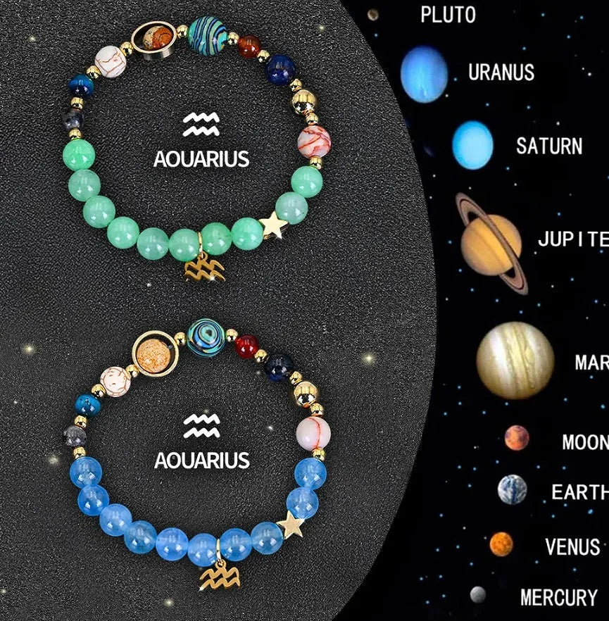 Two natural stone beaded bracelets with zodiac charms on a table, showing adjustable sliding knots.