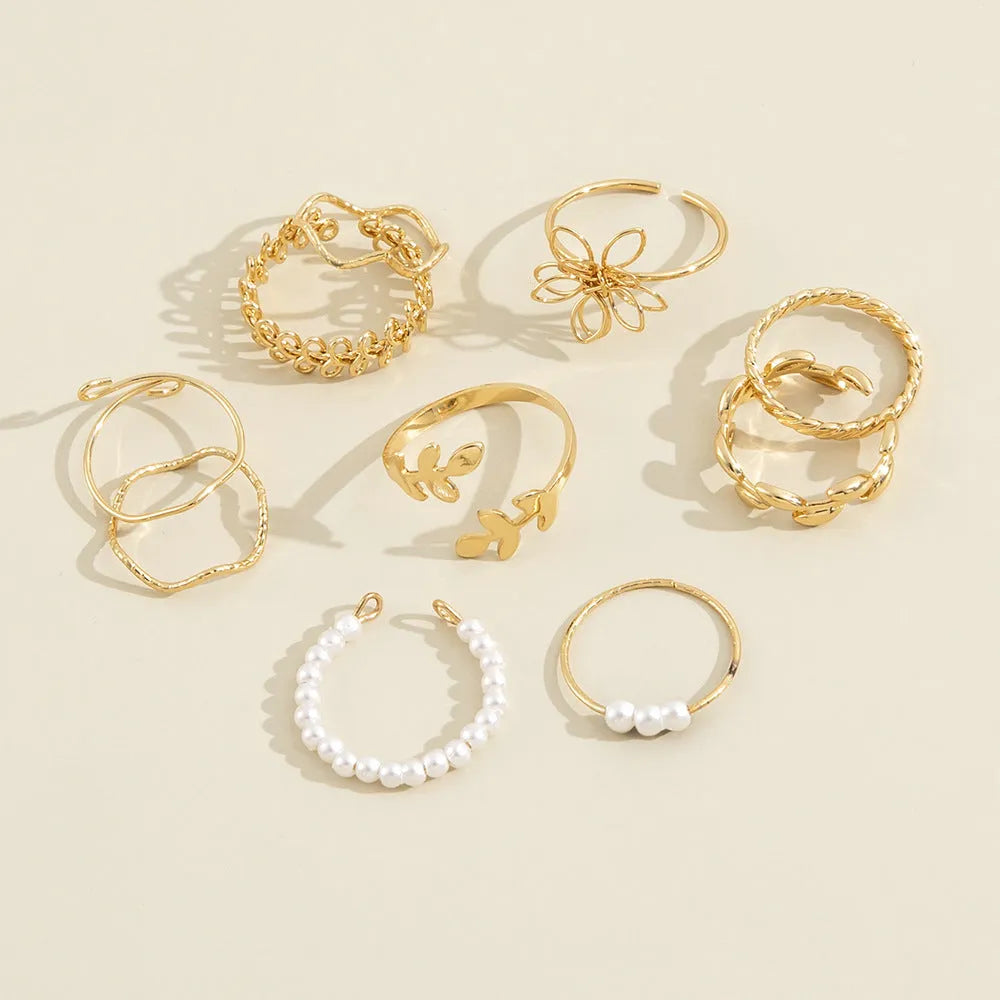 Gold-coloured openwork flower ring made from alloy with a glossy electroplated finish.