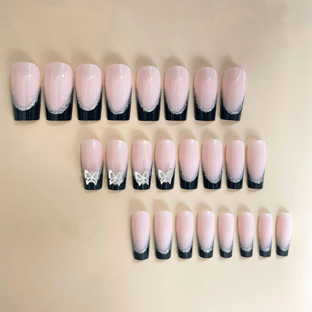 Black French style false nails with glittering butterfly design, medium length, from the BW50 Wear Armor set.