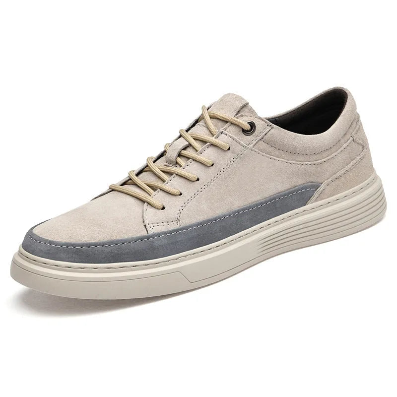 Men's grey casual leather skate shoes with a round toe and front lace-up on a soft rubber sole.