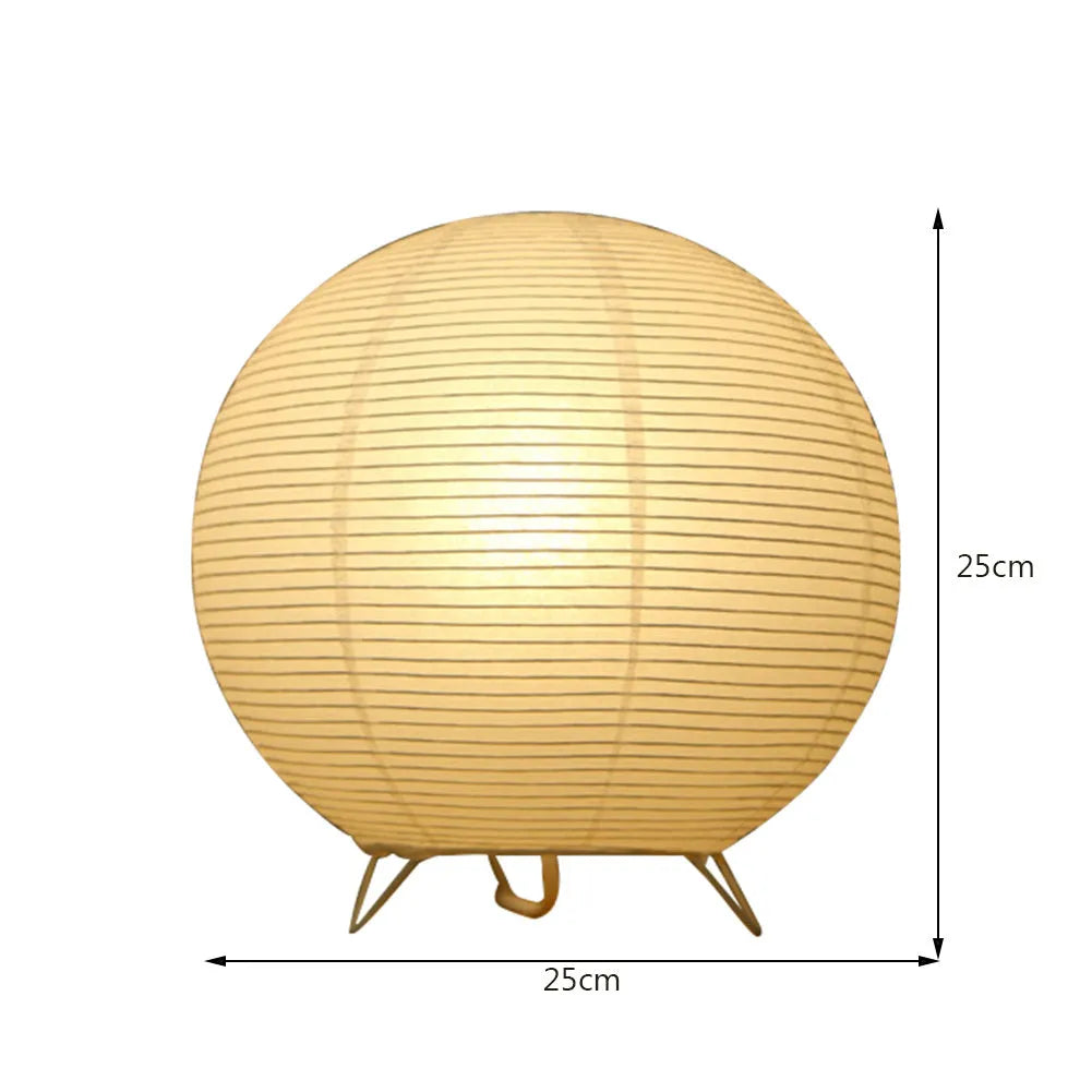 White traditional rice paper table lamp with E14 bulb holder on wooden desk