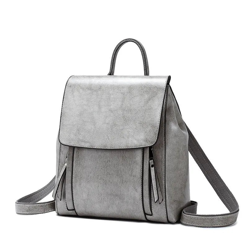 Large black genuine leather women's backpack with multiple inner pockets and double shoulder straps