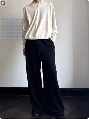 Man wearing a milky white pure wool polo collar sweater with a lapel design.