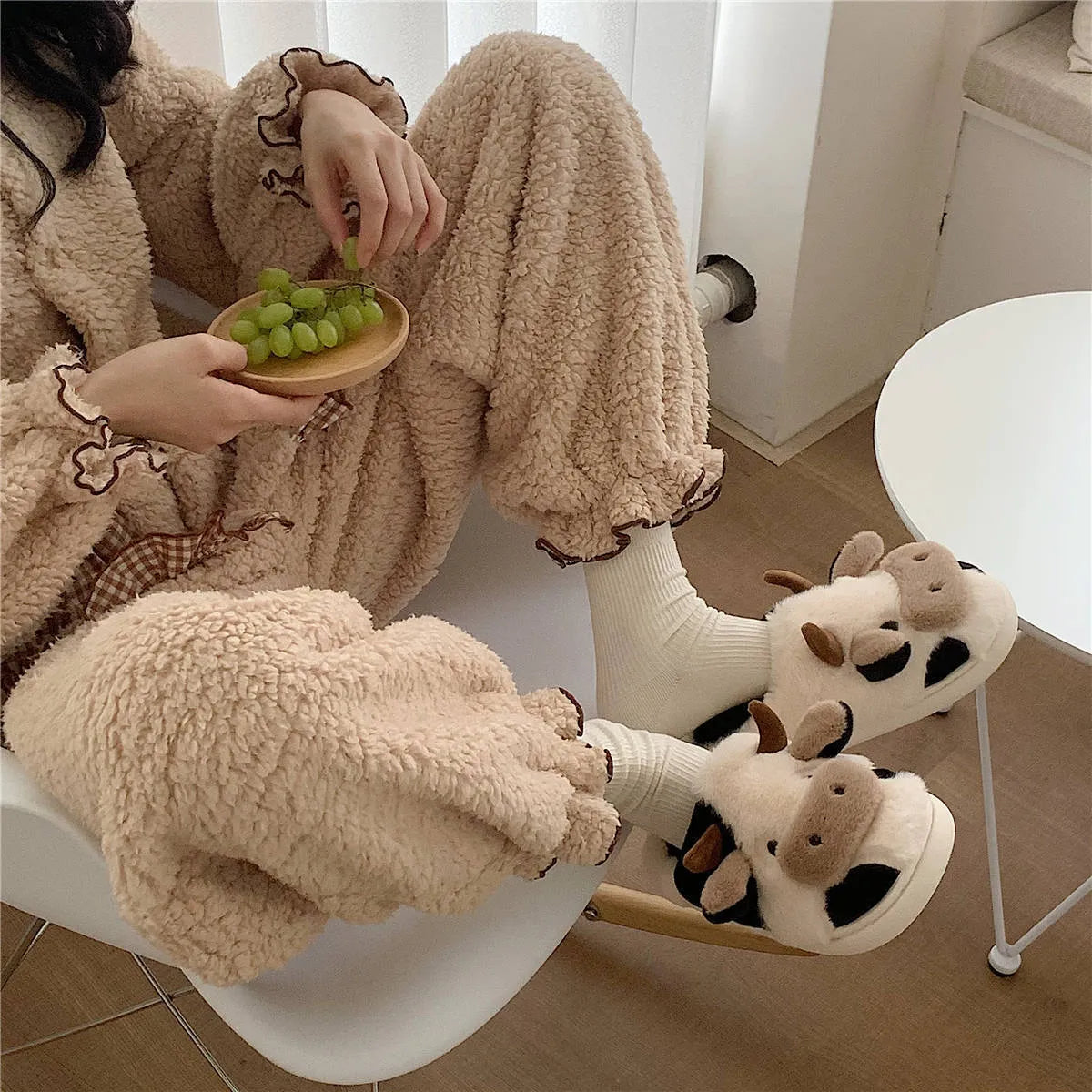 White cartoon cow slippers for women with soft faux fur and textured anti-slip soles