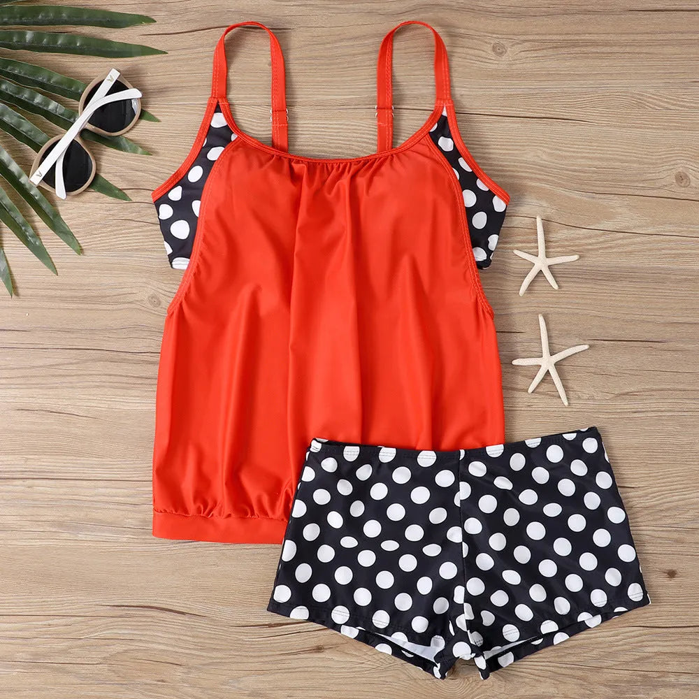 Women's black polka dot two-piece swimsuit with high-waisted boxer briefs.