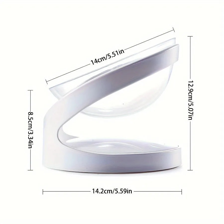 White elevated cat food bowl with a tilted surface on a raised platform.