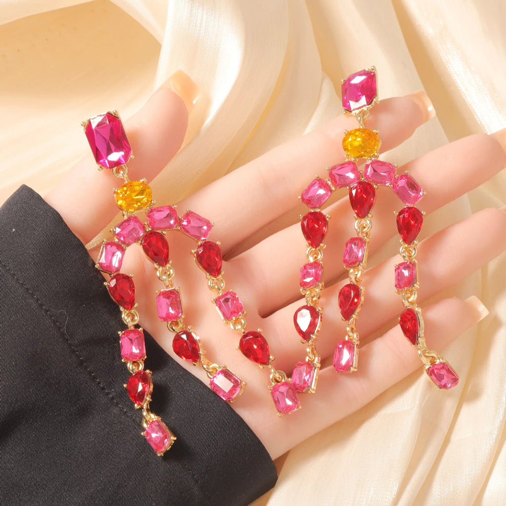 Heavy-duty full-drop diamond teardrop fringe earrings in zinc alloy, green colour, on display