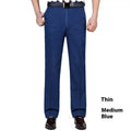 Men's high-waist loose-fit blue denim jeans with a zip fly, shown in light blue.