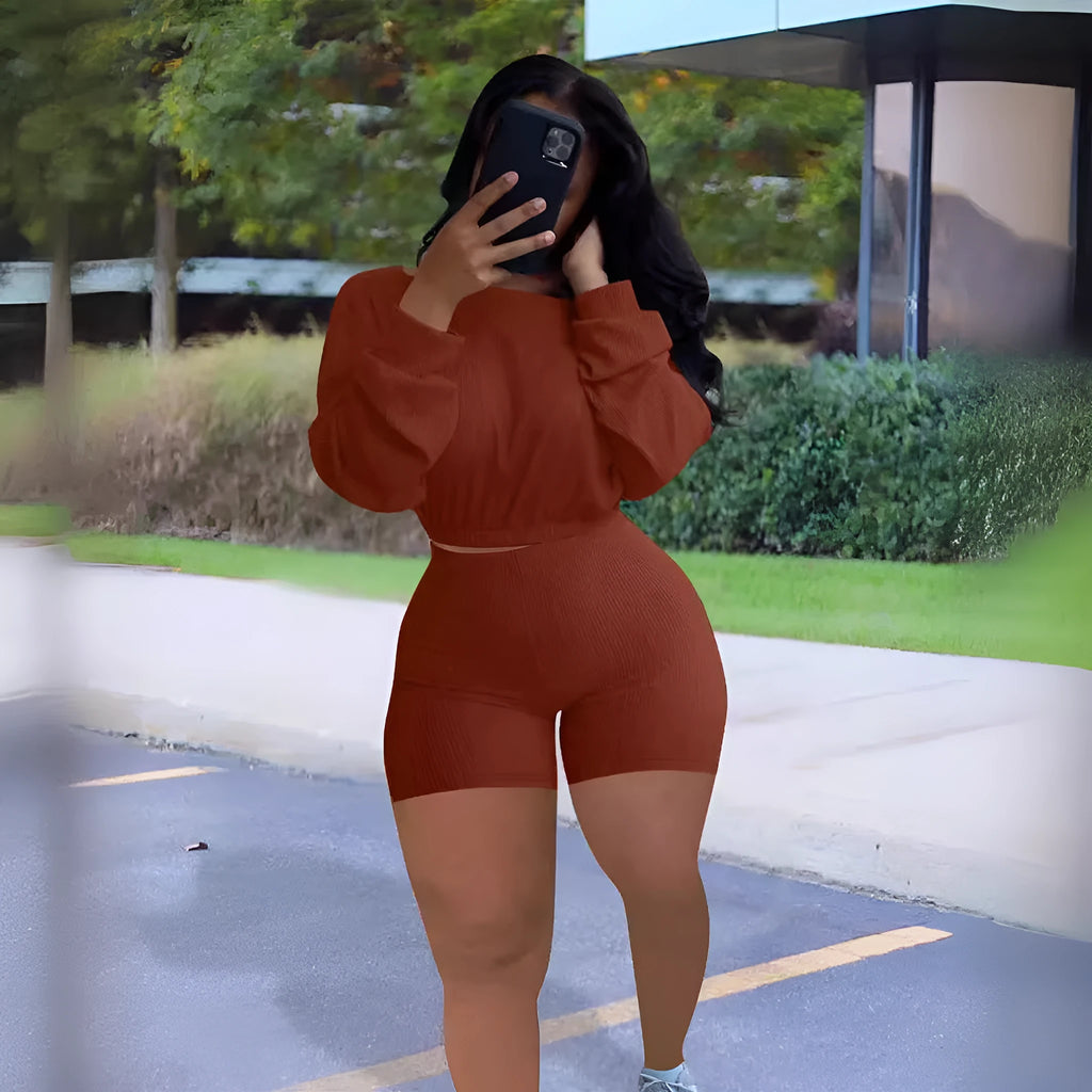 Off-the-shoulder long sleeve top and shorts two-piece set in a solid colour with a sunken stripe pattern.