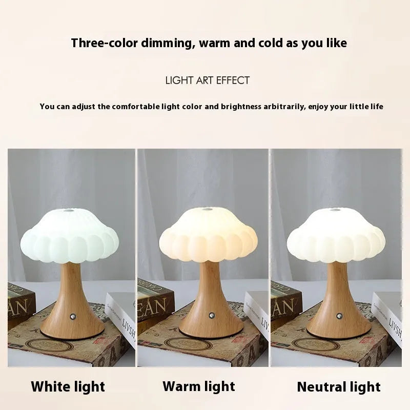 Small mushroom-shaped rechargeable night light in wood grain colour with touch control on desk.