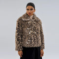 Women's leopard print coat with a buckle lapel, shown in street fashion style.