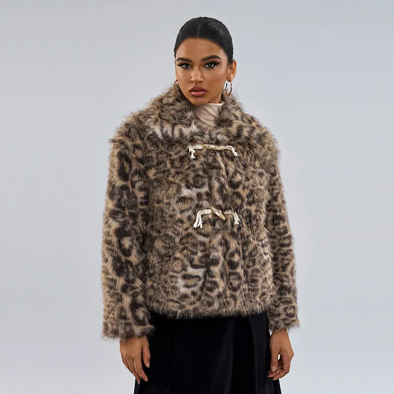 Women's leopard print coat with a buckle lapel, shown in street fashion style.